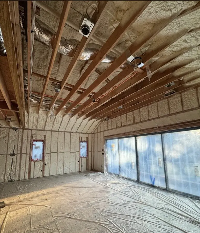 Interior walls and ceiling insulated with spray foam during new construction in Whiteland